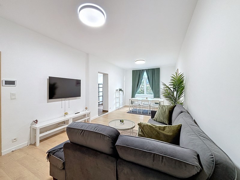 Salon aménagé et convivial du duplex en colocation Hellebaut 18